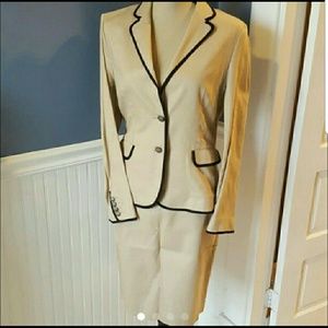 Linen blend suit in taupe with black trim.